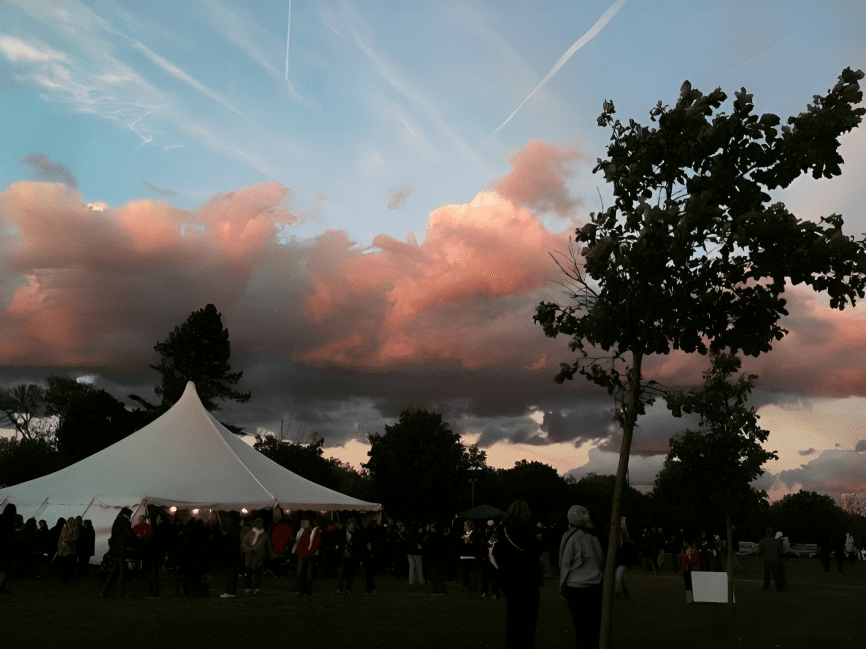 Evening sky over a lively gathering